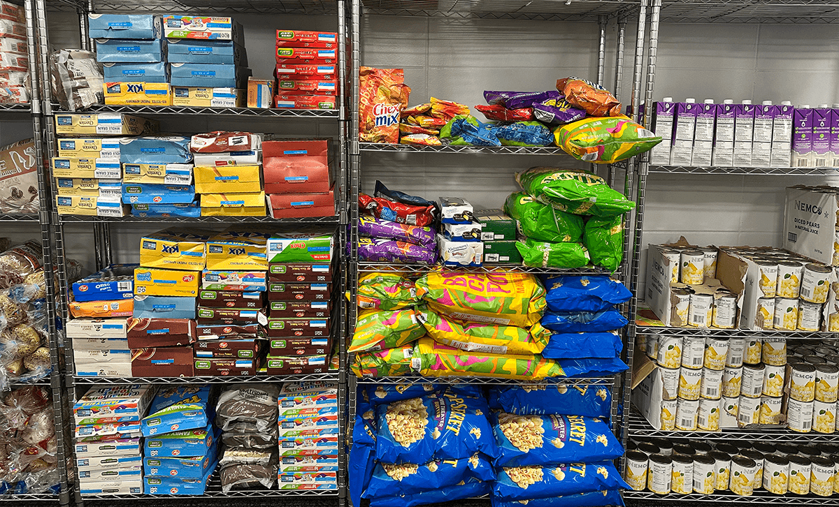 Fully stocked shelves at a food pantry. 